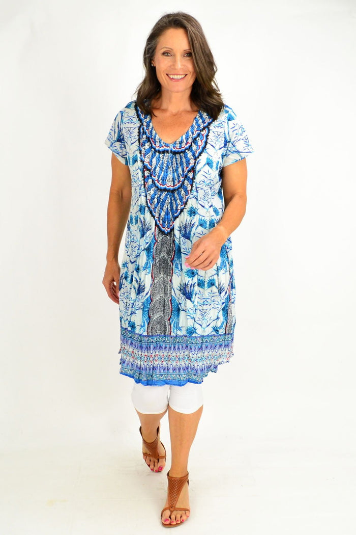 Blue Dream Catcher Tunic Top by One Summer, featuring flowing fabric and intricate design, displayed on a hanger.