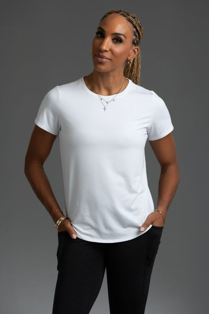 Person wearing a white t-shirt and black pants on a gray background || Black/Dark Heather Gray/White