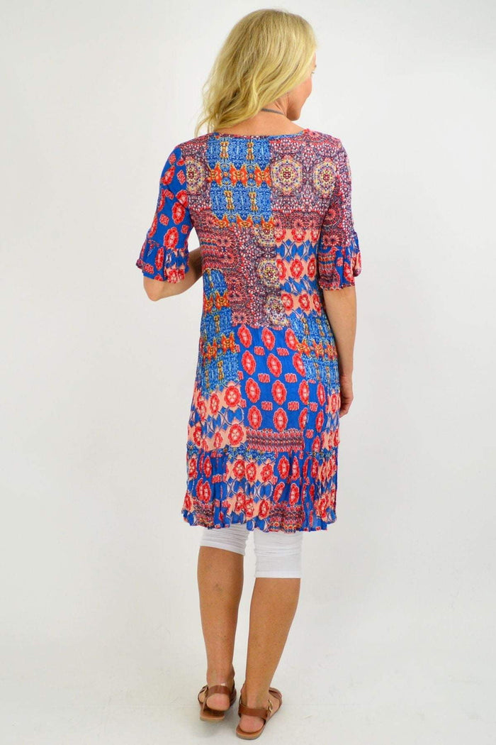 Mayan Blue Tunic Dress by One Summer featuring an intricate oriental print and relaxed fit, displayed on a hanger.