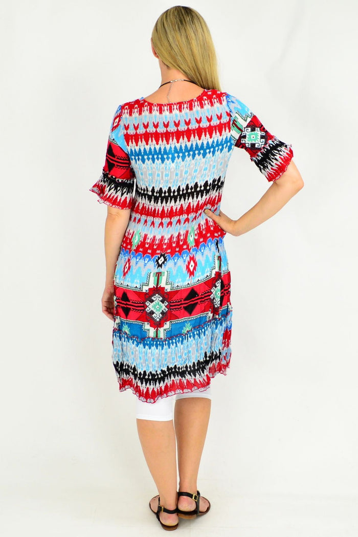 Peruvian Loom Crinkle Tunic Dress by One Summer, lightweight and textured with a relaxed fit, displayed on a hanger.