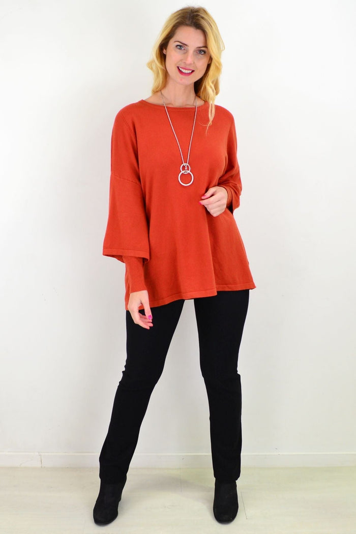 Orange Rust Debs double sleeve tunic jumper by Cali&Co, featuring a loose, flowy poncho-style design with layered sleeves.